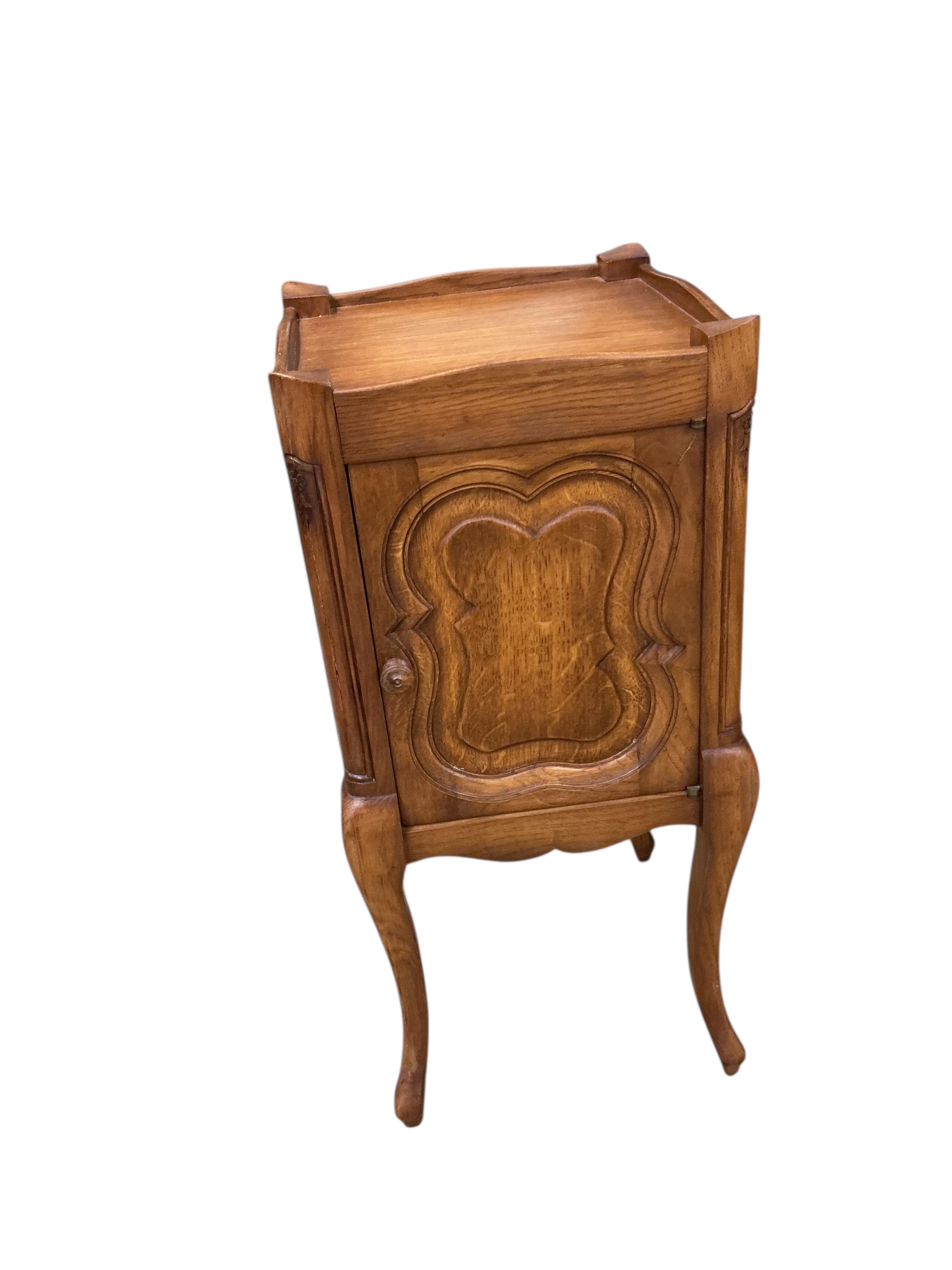 A pair of French oak bedside cabinets, width 34cm, depth 34cm, height 75cm